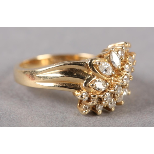 175 - A DIAMOND CLUSTER RING, the brilliant and marquise cut stones claw set in a leaf shaped outline flan... 