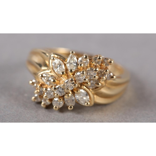 175 - A DIAMOND CLUSTER RING, the brilliant and marquise cut stones claw set in a leaf shaped outline flan... 