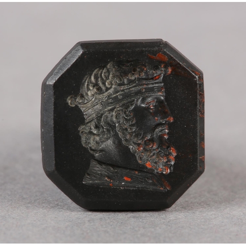 165 - A 19TH CENTURY HEMATITE SEAL FOB, of tapered octagonal outline with an intaglio of Richard The Lionh... 