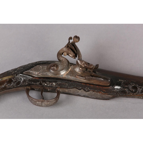 6 - A NINETEEN BORE OTTOMAN FLINTLOCK KUBER PISTOL C1800, tapering barrel with worn chiselled foliate sc... 