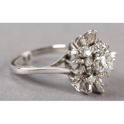 183 - A DIAMOND CLUSTER RING, the principal brilliant cut stone claw set and raised against undulating tie... 