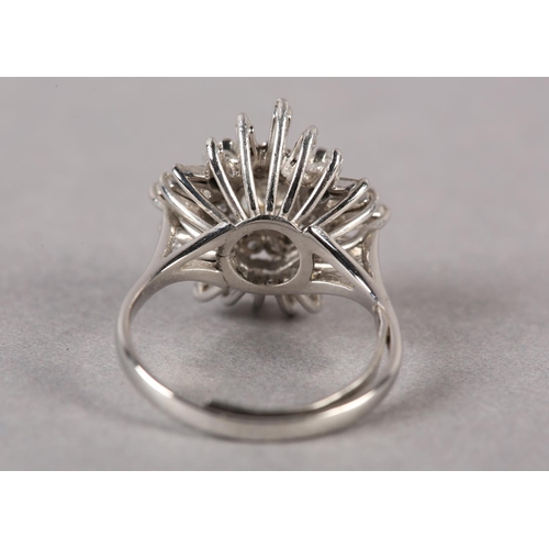 183 - A DIAMOND CLUSTER RING, the principal brilliant cut stone claw set and raised against undulating tie... 