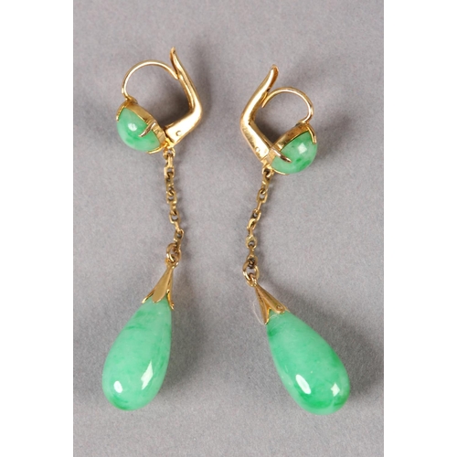 179 - A PAIR OF JADE EAR PENDANTS C1950, in 14ct gold, each set with a pear shaped jade drop hung on a tra... 