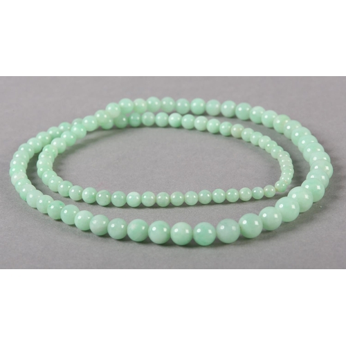 182 - A JADE NECKLACE OF GRADUATED SPHERICAL BEADS, without fastener and strung on a later line, approxima... 