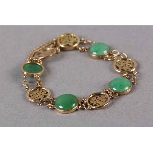 180 - A JADE BRACELET C1950 in 14ct gold, the circular cabochon stones collet set alternating with pierced... 