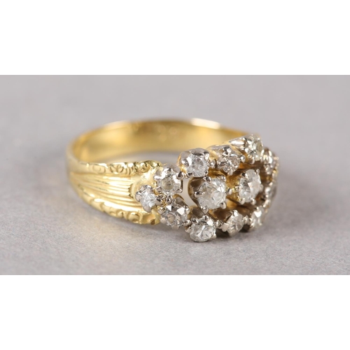 189 - A VICTORIAN DIAMOND CLUSTER RING in 18ct gold, the old European cut stones claw set within a pierced... 