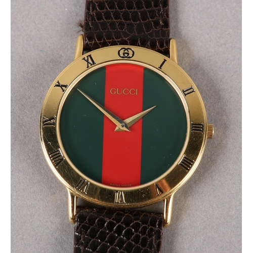 266 - A GUCCI QUARTZ WRISTWATCH, c1995, in rolled gold case no 0445654, burgundy and green striped sans he... 