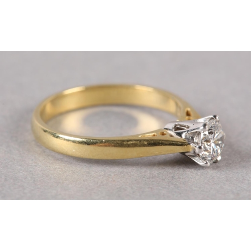 201 - A SINGLE STONE DIAMOND RING in 18ct yellow and white gold, the brilliant cut stone crown set, flanke... 