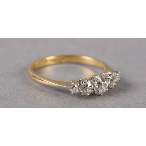 202 - A FIVE STONE DIAMOND RING C1950 in 18ct gold and platinum, the graduated transitional brilliant cut ... 