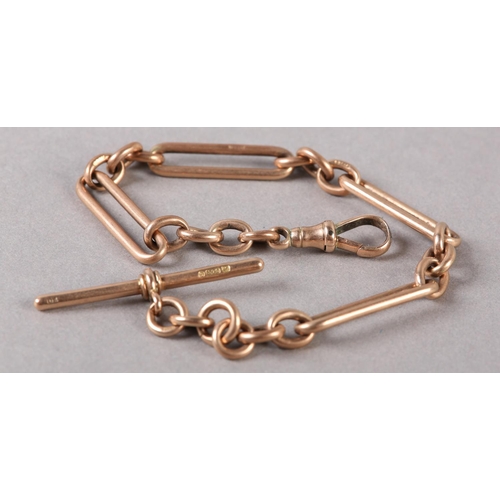 212 - A GEORGE V BRACELET IN 9CT ROSE GOLD FETTER AND TRACE LINKS with T bar and swivel fastener, approxim... 