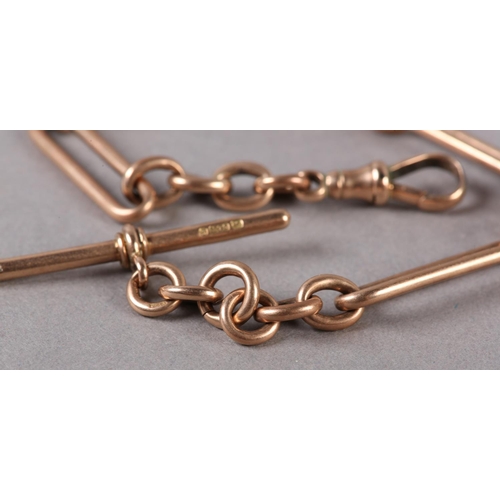 212 - A GEORGE V BRACELET IN 9CT ROSE GOLD FETTER AND TRACE LINKS with T bar and swivel fastener, approxim... 