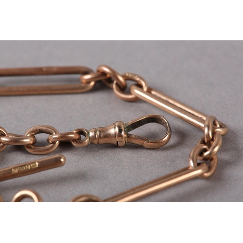 212 - A GEORGE V BRACELET IN 9CT ROSE GOLD FETTER AND TRACE LINKS with T bar and swivel fastener, approxim... 