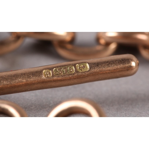 212 - A GEORGE V BRACELET IN 9CT ROSE GOLD FETTER AND TRACE LINKS with T bar and swivel fastener, approxim... 