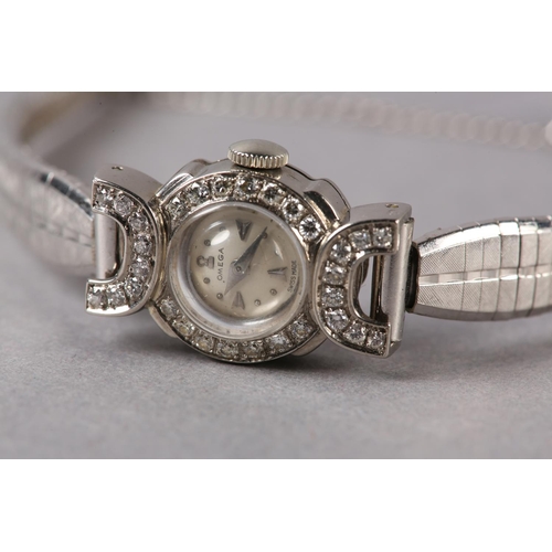 213 - AN OMEGA LADY'S DIAMOND SET COCKTAIL WATCH C1954 in 18ct white gold, 17 jewelled lever 213 movement ... 