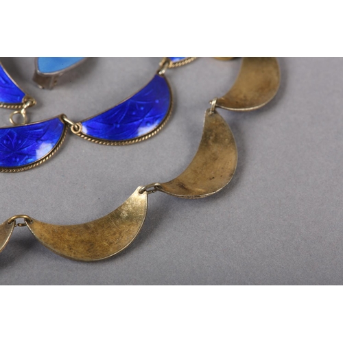 215 - A SCANDINAVIAN GUILLOCHE ENAMEL SILVER GILT NECKLACE C1960, each royal blue dished increscent with r... 