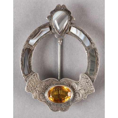 220 - A VICTORIAN SCOTTISH PEBBLE SILVER PLATED BROOCH collet set with agates and an oval faceted cairngor... 