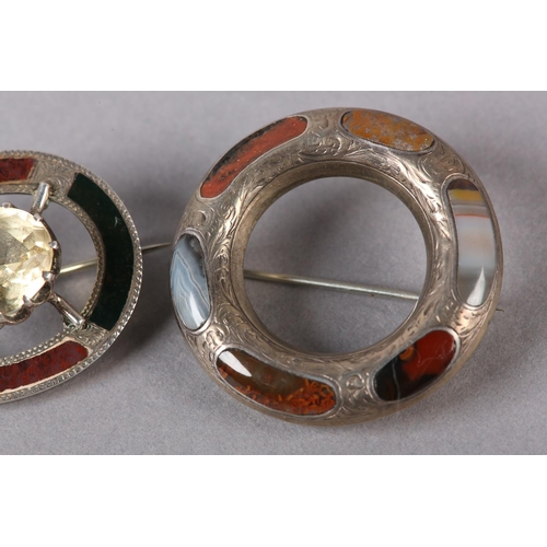 230 - A VICTORIAN SCOTTISH PEBBLE SILVER BROOCH, claw set to the centre with an oval faceted Cairngorm rai... 