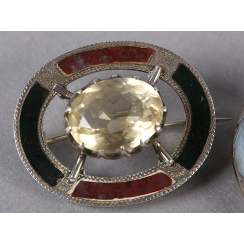 230 - A VICTORIAN SCOTTISH PEBBLE SILVER BROOCH, claw set to the centre with an oval faceted Cairngorm rai... 