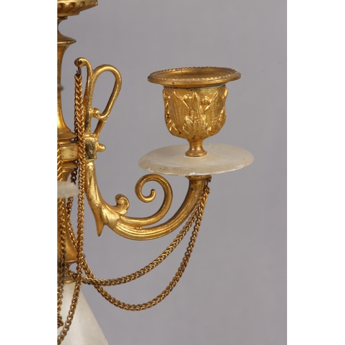 30 - PAIR OF GILT AND ALABASTER FOUR LIGHT CANDELABRAS, foliage sconces supported by scrolled arms with f... 