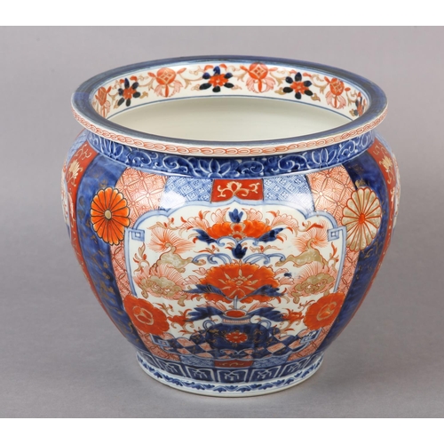 114 - A CHINESE IMARI JARDINIERE, the lobed body painted with alternating panels of scrollwork, diaper cel... 