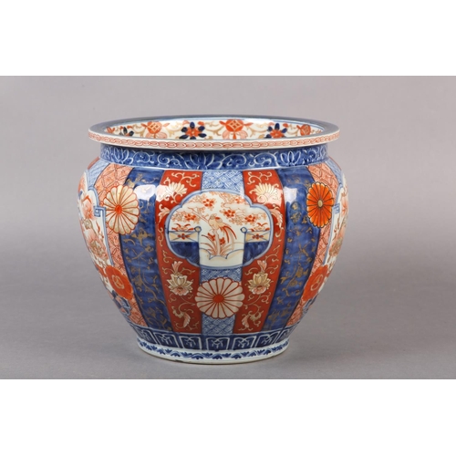 114 - A CHINESE IMARI JARDINIERE, the lobed body painted with alternating panels of scrollwork, diaper cel... 