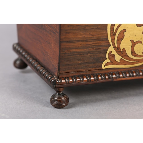 76 - AN EARLY 19TH CENTURY ROSEWOOD AND BRASS INLAID CADDY, of sarcophagus shape, the interior fitted wit... 