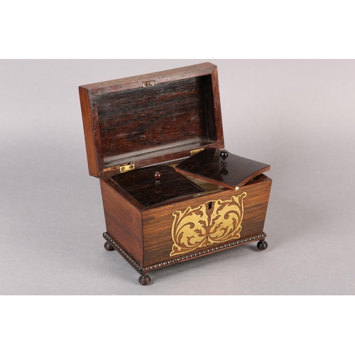 76 - AN EARLY 19TH CENTURY ROSEWOOD AND BRASS INLAID CADDY, of sarcophagus shape, the interior fitted wit... 