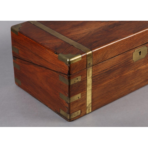 77 - A MID 19TH CENTURY ROSEWOOD AND BRASS BOUND WRITING BOX, the interior fitted with leather incised wr... 