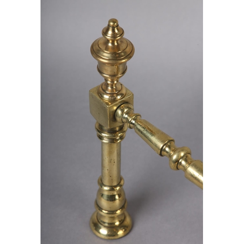 50 - A PAIR OF VICTORIAN BRASS FIRE DOGS, each having a reeded ball and baluster upright with knop finial... 