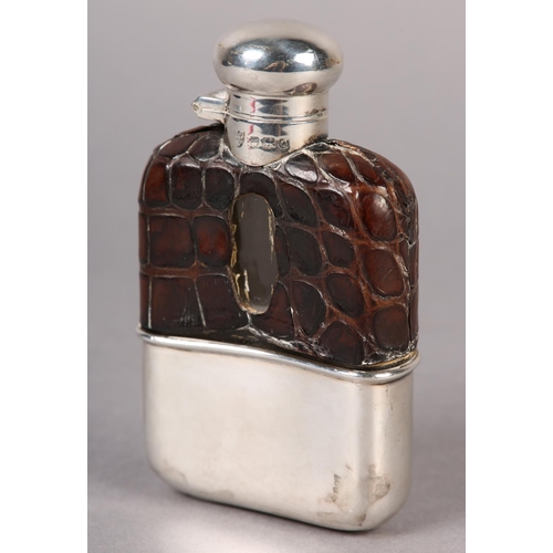 152 - A GEORGE VI SILVER AND CROCODILE SKIN COVERED GLASS SPIRIT FLASK, Sheffield 1949, 11cm high