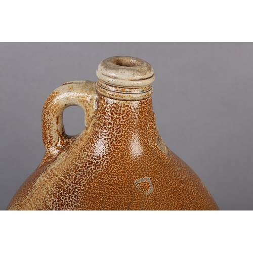 95 - A LATE 17TH/EARLY 18TH CENTURY RHENISH BELLARMINE of typical form, salt glaze stoneware, impressed t... 