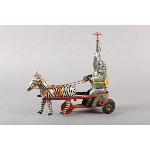 33 - A GERMAN US ZONE TINPLATE CLOCKWORK ELEPHANT AND ZEBRA CIRCUS ACT, 24cm wide x 21.5cm high, together... 