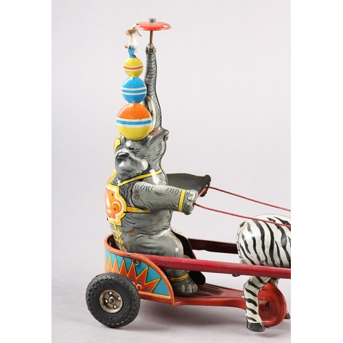 33 - A GERMAN US ZONE TINPLATE CLOCKWORK ELEPHANT AND ZEBRA CIRCUS ACT, 24cm wide x 21.5cm high, together... 