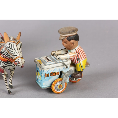 33 - A GERMAN US ZONE TINPLATE CLOCKWORK ELEPHANT AND ZEBRA CIRCUS ACT, 24cm wide x 21.5cm high, together... 