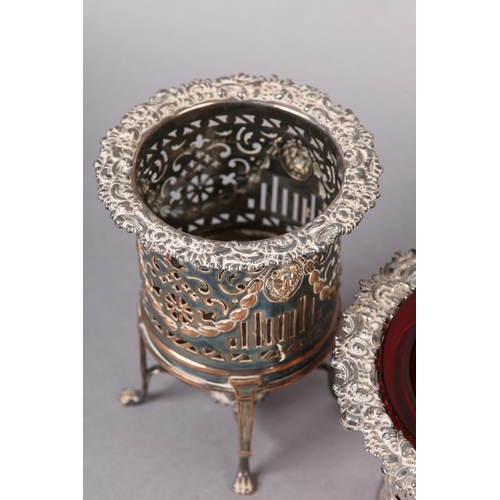 150 - A 19TH CENTURY SET OF THREE PLATED ON COPPER WINE COASTERS, comprising a pair of wine bottle stands ... 