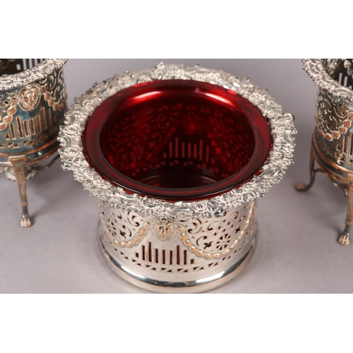 150 - A 19TH CENTURY SET OF THREE PLATED ON COPPER WINE COASTERS, comprising a pair of wine bottle stands ... 