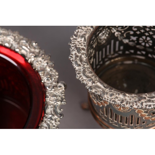 150 - A 19TH CENTURY SET OF THREE PLATED ON COPPER WINE COASTERS, comprising a pair of wine bottle stands ... 