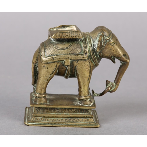 54 - A LATE 18TH/EARLY 19TH CENTURY BRASS CAPARISONED ELEPHANT, cast and engraved in the South Indian or ... 