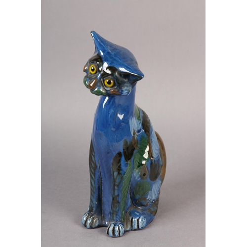 92 - A C H BRANNUM 'BARUM' EARTHENWARE SITTING CAT, glazed in mid blue, green, brown and pale blue, with ... 