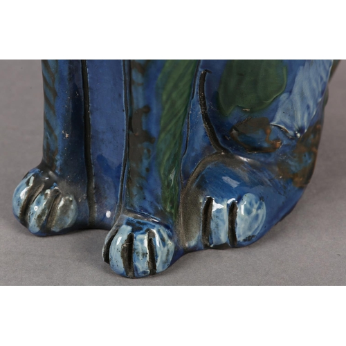 92 - A C H BRANNUM 'BARUM' EARTHENWARE SITTING CAT, glazed in mid blue, green, brown and pale blue, with ... 