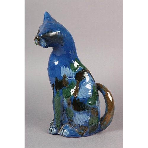 92 - A C H BRANNUM 'BARUM' EARTHENWARE SITTING CAT, glazed in mid blue, green, brown and pale blue, with ... 