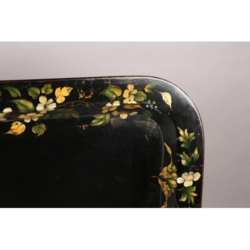 73 - A MID-19TH CENTURY PAPIER MÂCHÉ TRAY, rectangular with rounded corners, the black ground painted and... 