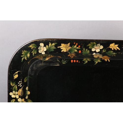 73 - A MID-19TH CENTURY PAPIER MÂCHÉ TRAY, rectangular with rounded corners, the black ground painted and... 