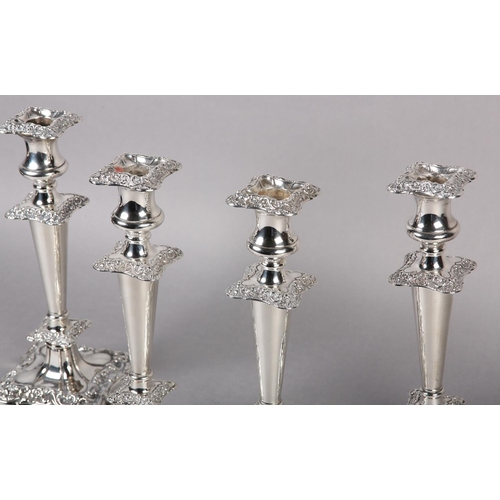 158 - A SET OF FOUR GEORGE V SILVER CANDLESTICKS, Chester 1910 Herbert Edward and Frank Ernest Barker, hav... 