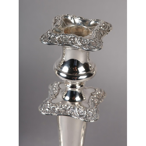 158 - A SET OF FOUR GEORGE V SILVER CANDLESTICKS, Chester 1910 Herbert Edward and Frank Ernest Barker, hav... 