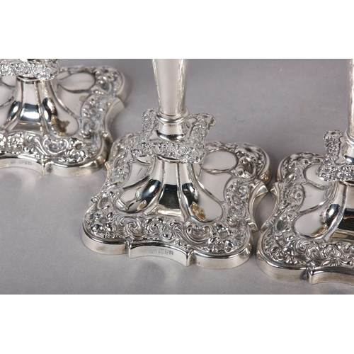 158 - A SET OF FOUR GEORGE V SILVER CANDLESTICKS, Chester 1910 Herbert Edward and Frank Ernest Barker, hav... 