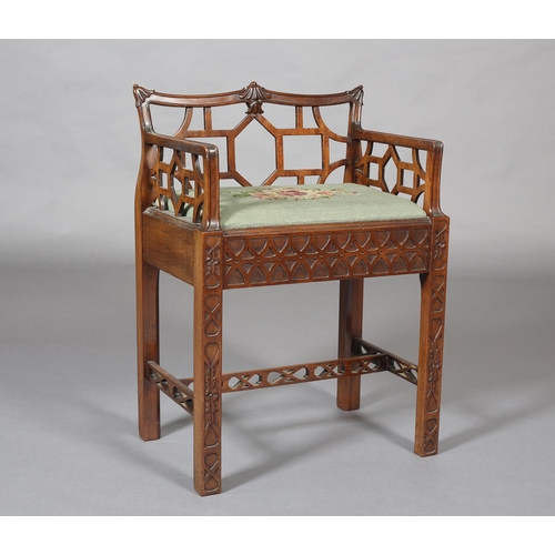 376 - A CHINESE CHIPPENDALE REVIVAL mahogany dressing stool, having a low fretwork back and side panels, n... 