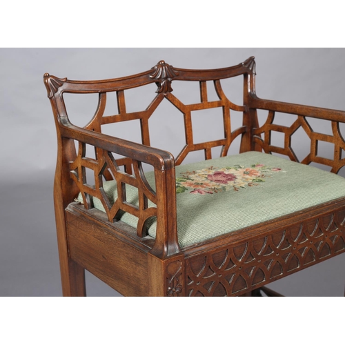 376 - A CHINESE CHIPPENDALE REVIVAL mahogany dressing stool, having a low fretwork back and side panels, n... 