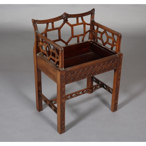 376 - A CHINESE CHIPPENDALE REVIVAL mahogany dressing stool, having a low fretwork back and side panels, n... 