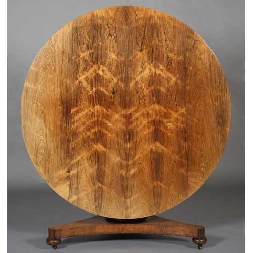 372 - A MID 19TH CENTURY ROSEWOOD BREAKFAST TABLE, having a circular tilt top with bead and reel to the fr... 